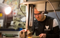 student in machine shop. 